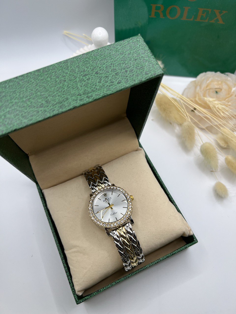 Montre Rolex à cadran blanc et ceinture bicolore dorée et argentéeT